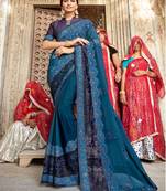 Blue embroidered georgette saree with blouse