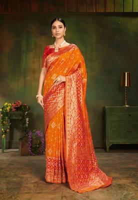 Orange woven silk saree with blouse 1