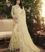 Cream embroidered silk saree with blouse