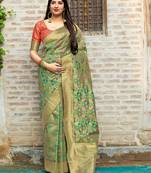 Green woven banarasi saree with blouse