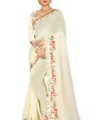 Cream embroidered georgette saree with blouse