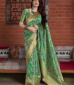Green woven banarasi silk saree with blouse