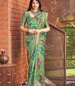 Green woven banarasi silk saree with blouse