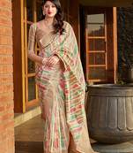 Off white woven banarasi silk saree with blouse