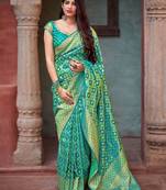 Turquoise woven banarasi silk saree with blouse