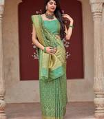 Green woven banarasi silk saree with blouse
