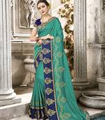 Green embroidered satin saree with blouse