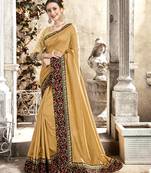 Cream embroidered satin saree with blouse