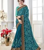Blue embroidered georgette saree with blouse