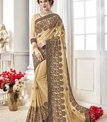 Cream embroidered georgette saree with blouse