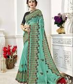 Green embroidered georgette saree with blouse