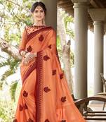 Orange embroidered georgette saree with blouse