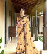 Cream embroidered georgette saree with blouse