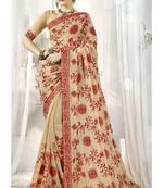 Cream embroidered satin saree with blouse