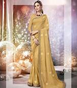 Cream embroidered georgette saree with blouse