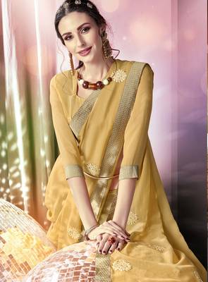 Cream embroidered georgette saree with blouse 2