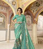 Green embroidered satin saree with blouse