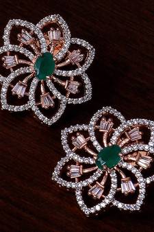 Emerald embellished rose gold plated american diamond earrings