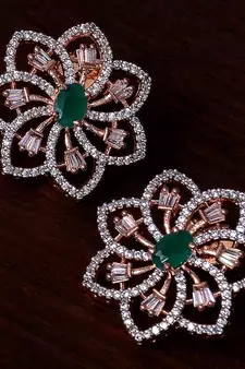 Emerald embellished rose gold plated american diamond earrings