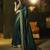 Dark green embroidered silk saree with blouse