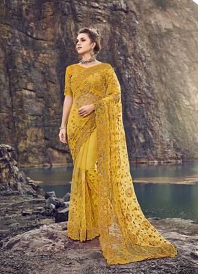 Yellow embroidered net saree with blouse 1