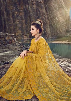 Yellow embroidered net saree with blouse 2