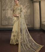 Cream Embroidered Net Saree With Blouse