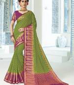 Green woven raw silk saree with blouse