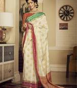 Cream woven banarasi silk saree with blouse