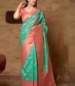 Green woven banarasi silk saree with blouse