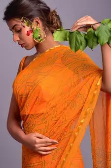 yellow printed bandhej chiffon saree with blouse
