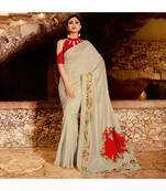 Cream embroidered Silk blend saree with blouse