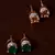 Emerald and Champagne Stone Embellished American Diamond Stud 216ED307