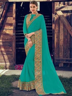 turquoise embroidered chiffon saree with blouse 1