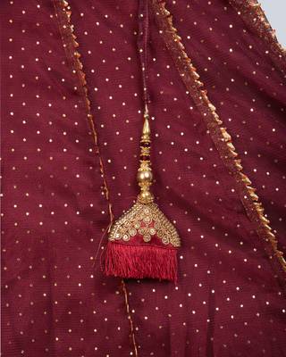 sleeveless  peplum choli with maroon net lehnga 1