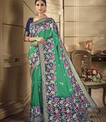 Green woven banarasi silk saree with blouse