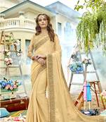 Cream embroidered chiffon saree with blouse