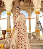 Cream embroidered georgette saree with blouse