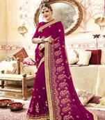 Pink embroidered georgette saree with blouse