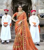 Orange embroidered silk saree with blouse