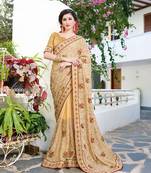 Beige embroidered georgette saree with blouse