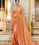 Orange embroidered silk saree with blouse