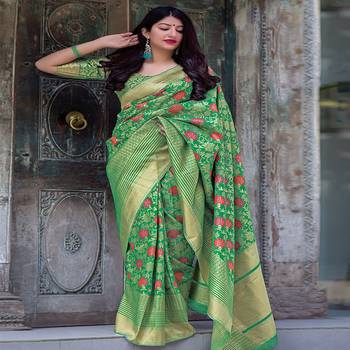 Green woven silk blend saree with blouse 1