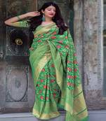Green woven silk blend saree with blouse