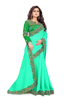 Dark green embroidered silk saree with blouse 1