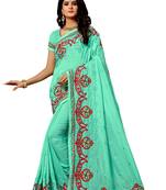 Dark green embroidered silk saree with blouse