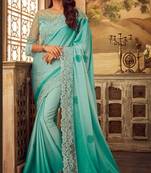Sky blue embroidered satin saree with blouse