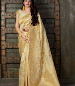 Cream woven banarasi silk saree with blouse