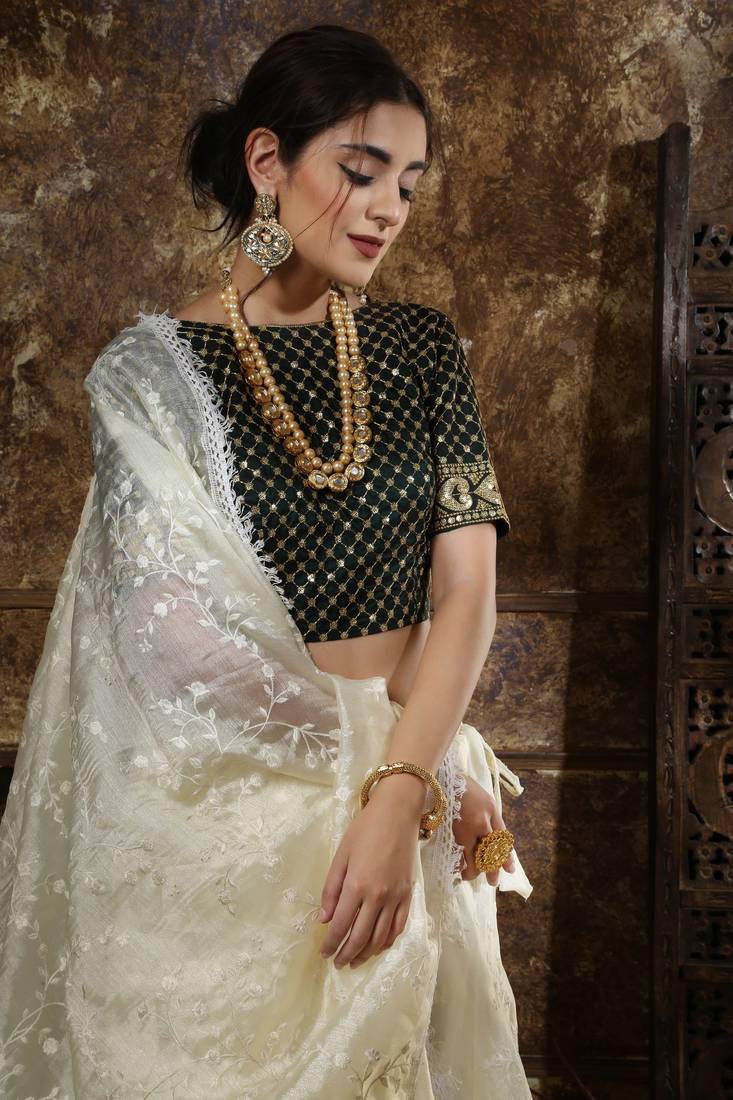 Off White Thread And Sequins Embroidered Organza Semi Stitched Lehenga