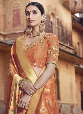 Orange woven silk blend saree with blouse 2